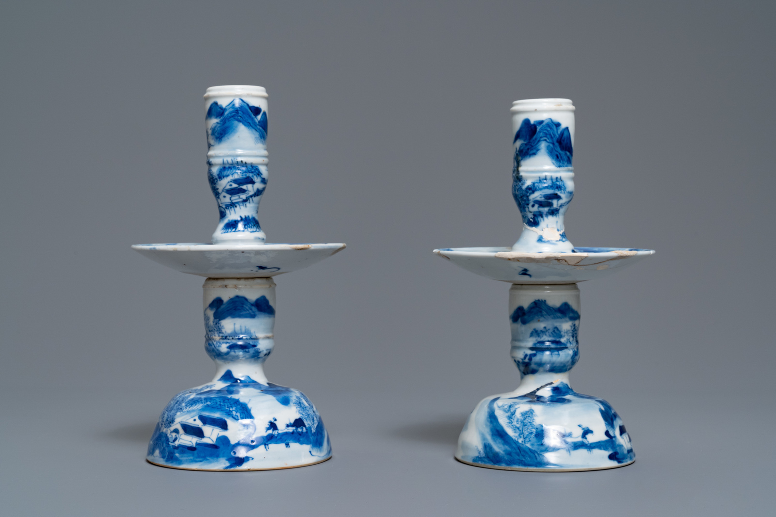 A pair of Chinese blue and white candlesticks and three famille rose figures of boys, 19th C. - Image 3 of 16