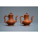 A pair of Chinese Yixing stoneware ewers with applied prunus design, Kangxi