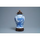 A Chinese blue and white 'dragon' vase with wooden cover and stand, Kangxi