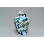 A Chinese wucai baluster vase and cover with playing boys, Transitional period