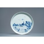 A Chinese blue and white 'river landscape' dish, Kangxi/Yongzheng