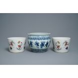A pair of Chinese famille rose jardinires and a blue and white example, 19th C.