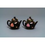 A pair of Chinese famille rose black-ground teapots and covers, Yongzheng/Qianlong