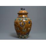 A large Chinese polychrome stoneware martaban jar and cover, Ming/Qing