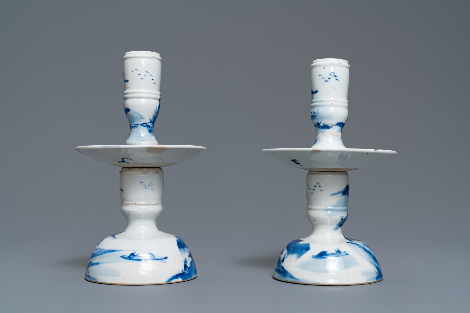 A pair of Chinese blue and white candlesticks and three famille rose figures of boys, 19th C. - Image 5 of 16