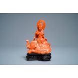 A Chinese carved red coral group of Guanyin on an elephant, 19th C.