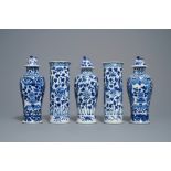 A Chinese blue and white five-piece garniture with peacocks, Kangxi mark, 19th C.