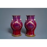 A pair of Chinese flambé-glazed vases on gilt bronze stands, 18/19th C.
