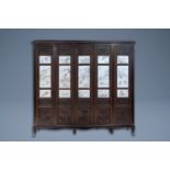 (NO ONLINE BIDDING) A Chinese wooden closet with 23 qianjiang cai plaques, 19/20th C.