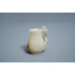 A Chinese celadon russet jade chilong- Handled jug, Qing