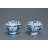 A pair of Chinese blue and white 'lotus scroll' bowls and covers, 19th C.