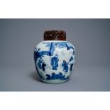 A Chinese blue & white ginger jar with figures in a landscape and wooden cover, Transitional period