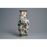 A Chinese hexagonal famille rose 'Buddhist lions and peacocks' vase, 19th C.