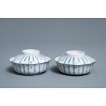 A pair of Chinese blue and white Vietnamese market 'Bleu de Hue' bowls and covers, 19th C.