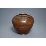 A Chinese brown-glazed cizhou jar with incised design, Yuan