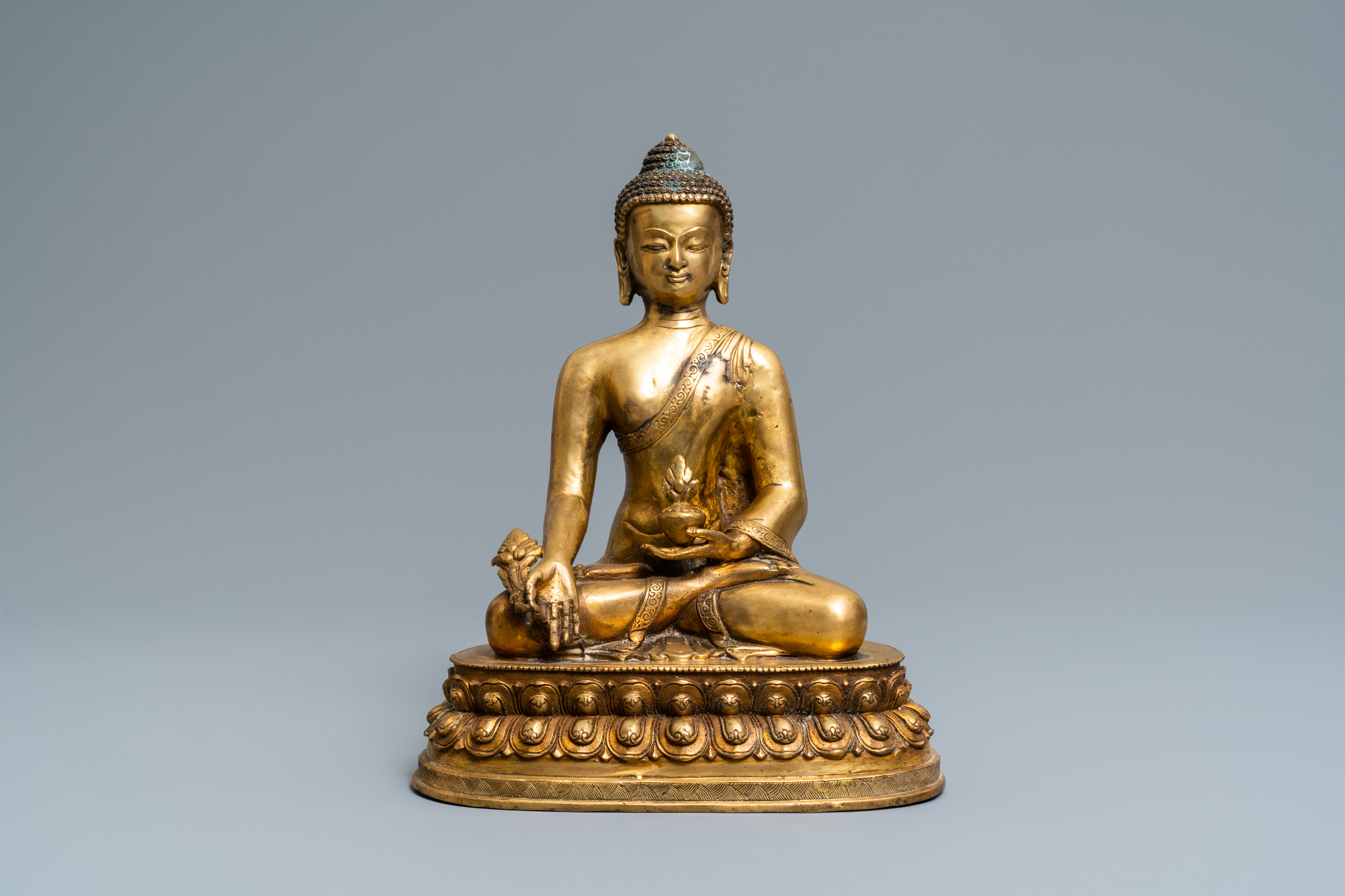 A Tibetan gilt bronze figure of Buddha, early 20th C.