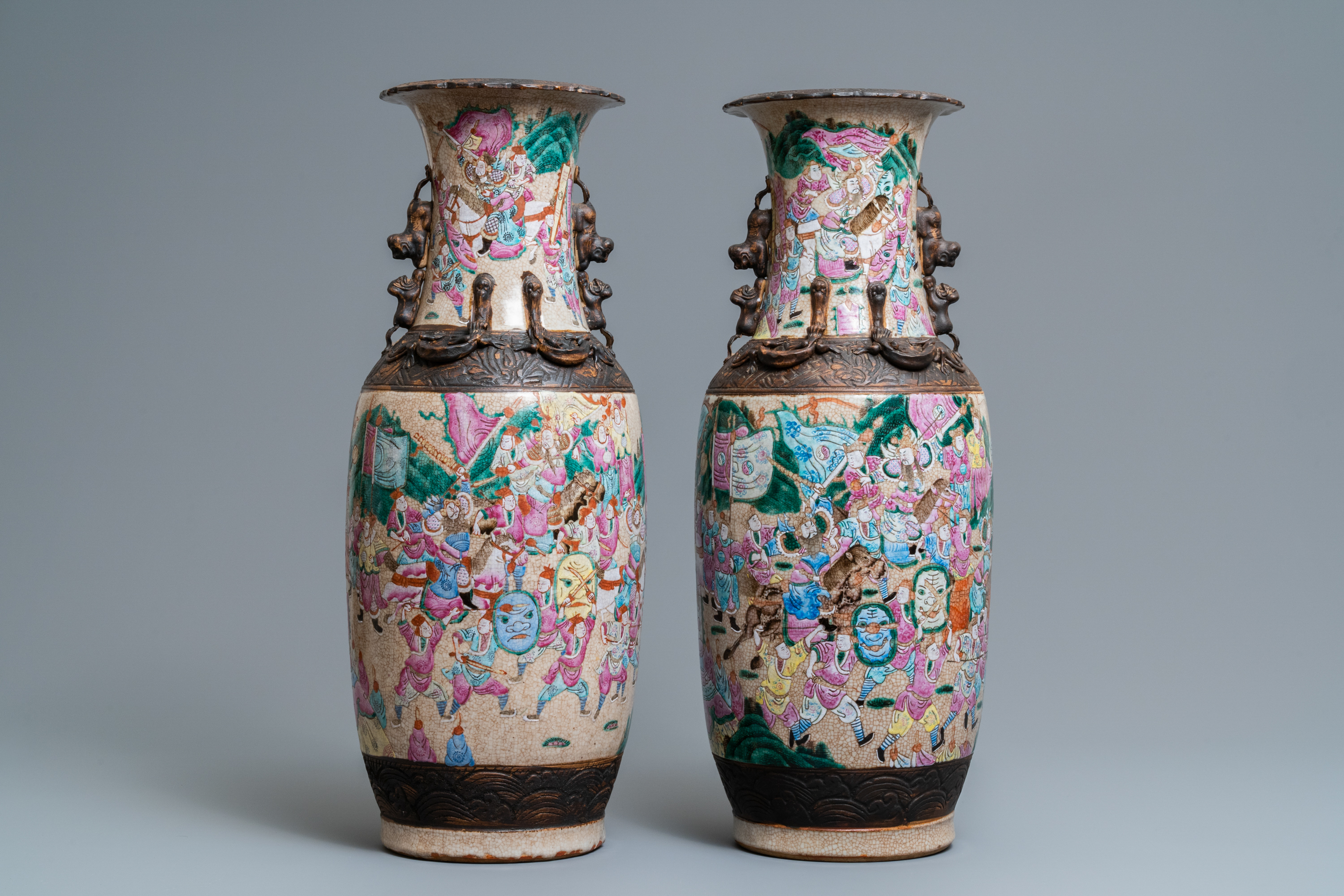 A pair of Chinese Nanking famille rose crackle-glazed 'warrior' vases, 19th C. - Image 3 of 6