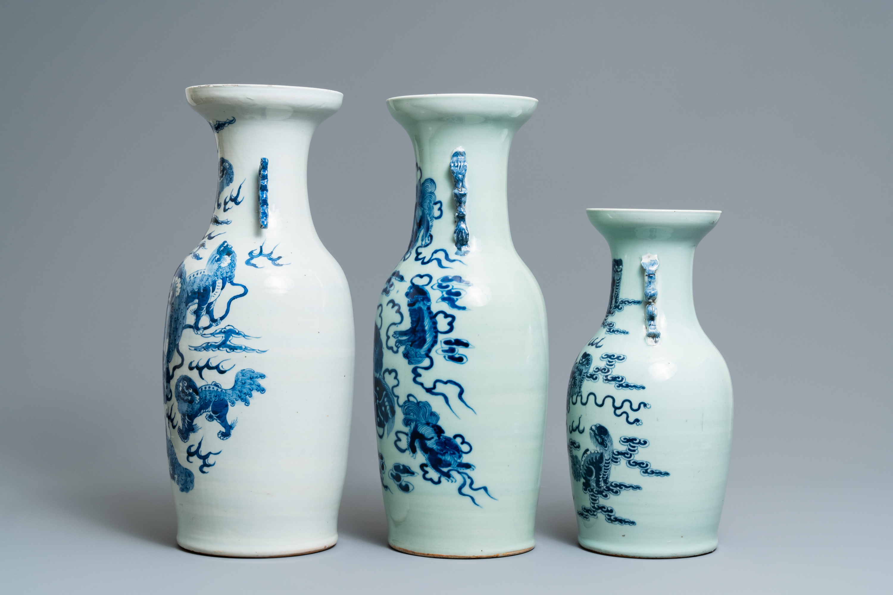 Three Chinese blue and white and celadon-ground 'Buddhist lion' vases, 19th C. - Image 4 of 6