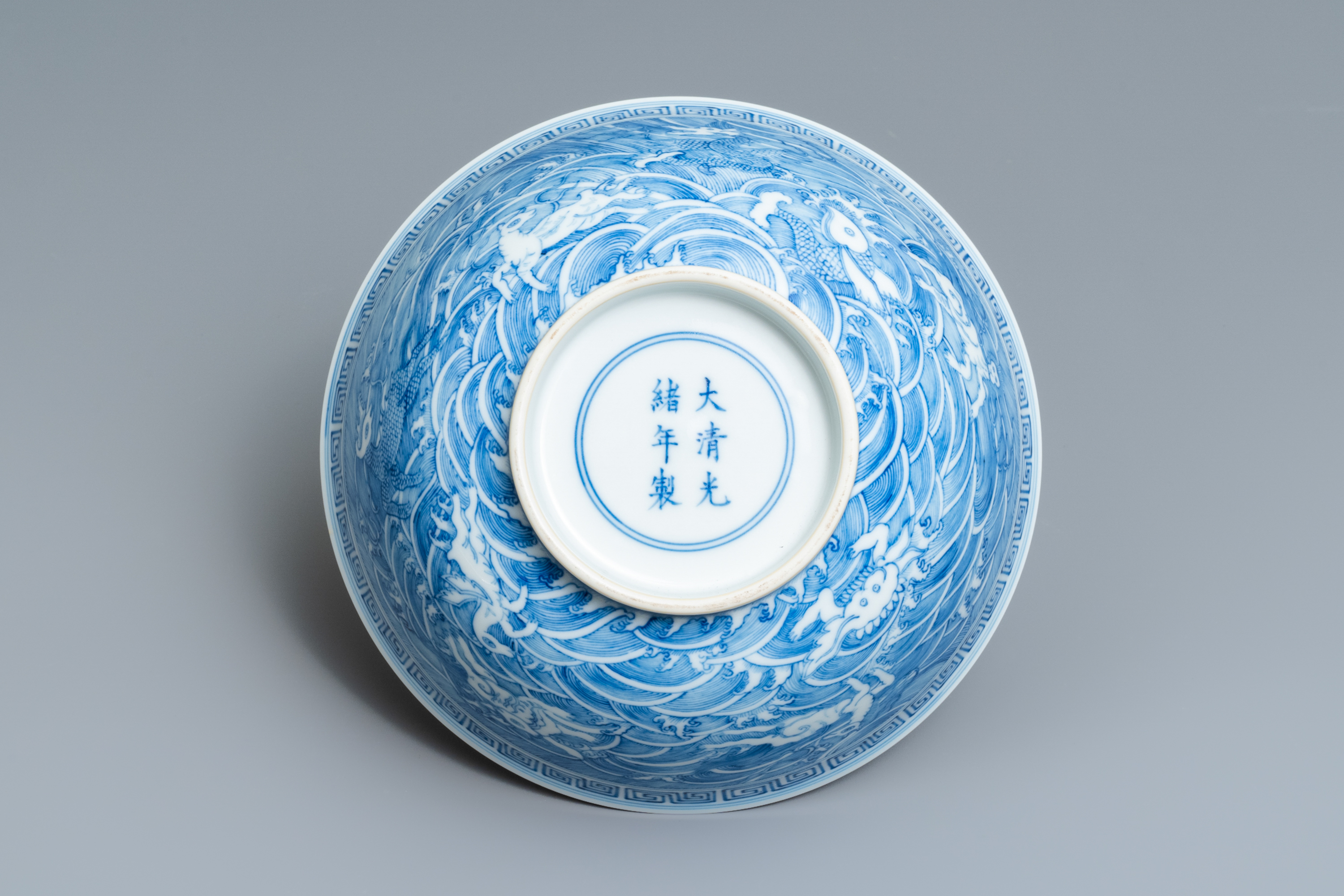 A Chinese blue and white 'mythical beasts' bowl, Guangxu mark, 19/20th C. - Image 7 of 7