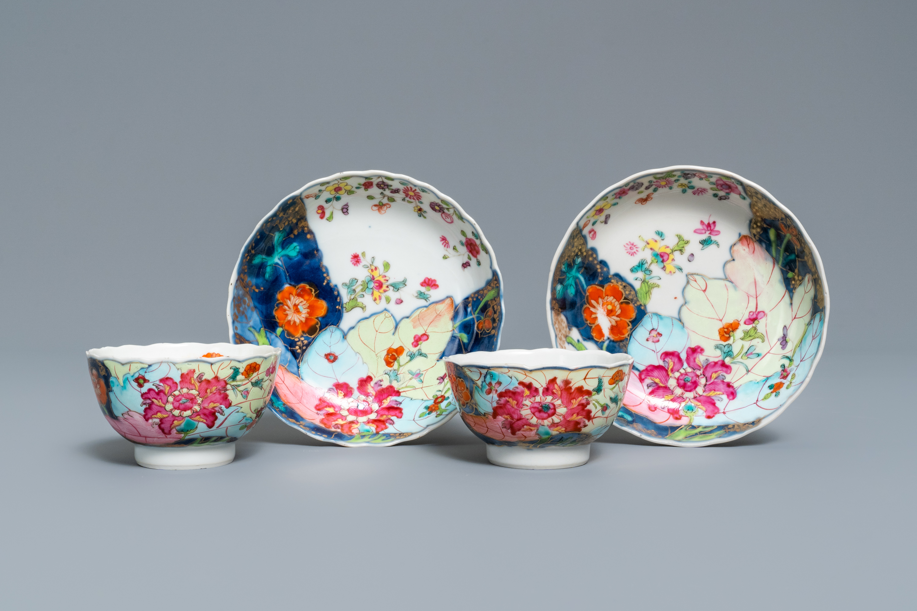 A pair of Chinese famille rose 'Tobacco leaf' cups and saucers, Qianlong