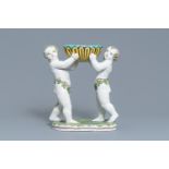 A polychrome faience group with two Bacchus figures, Geo Martel, Dèsvres, early 20th C.