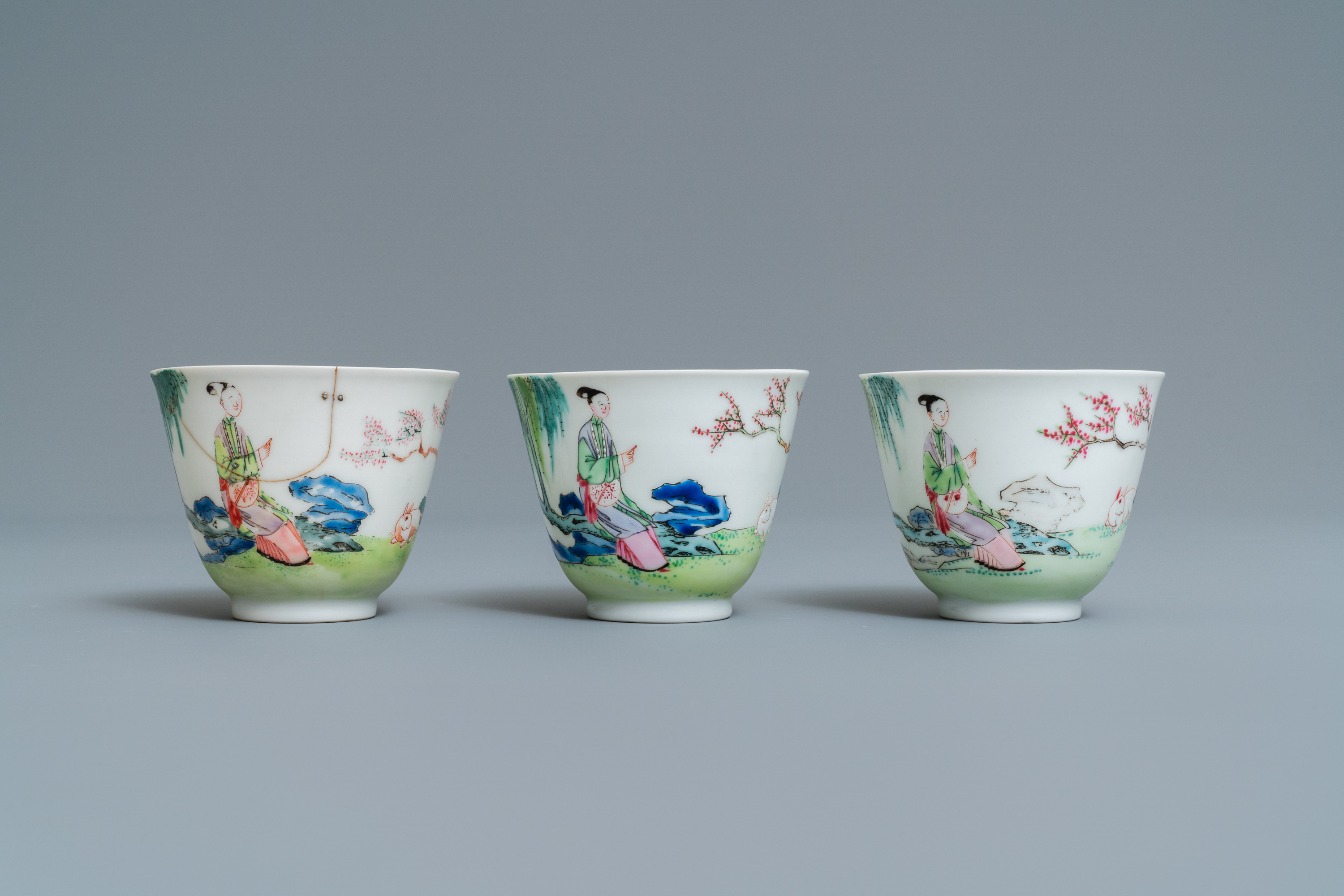 Three Chinese famille rose cups and saucers with figures in a garden, Yongzheng - Image 5 of 9