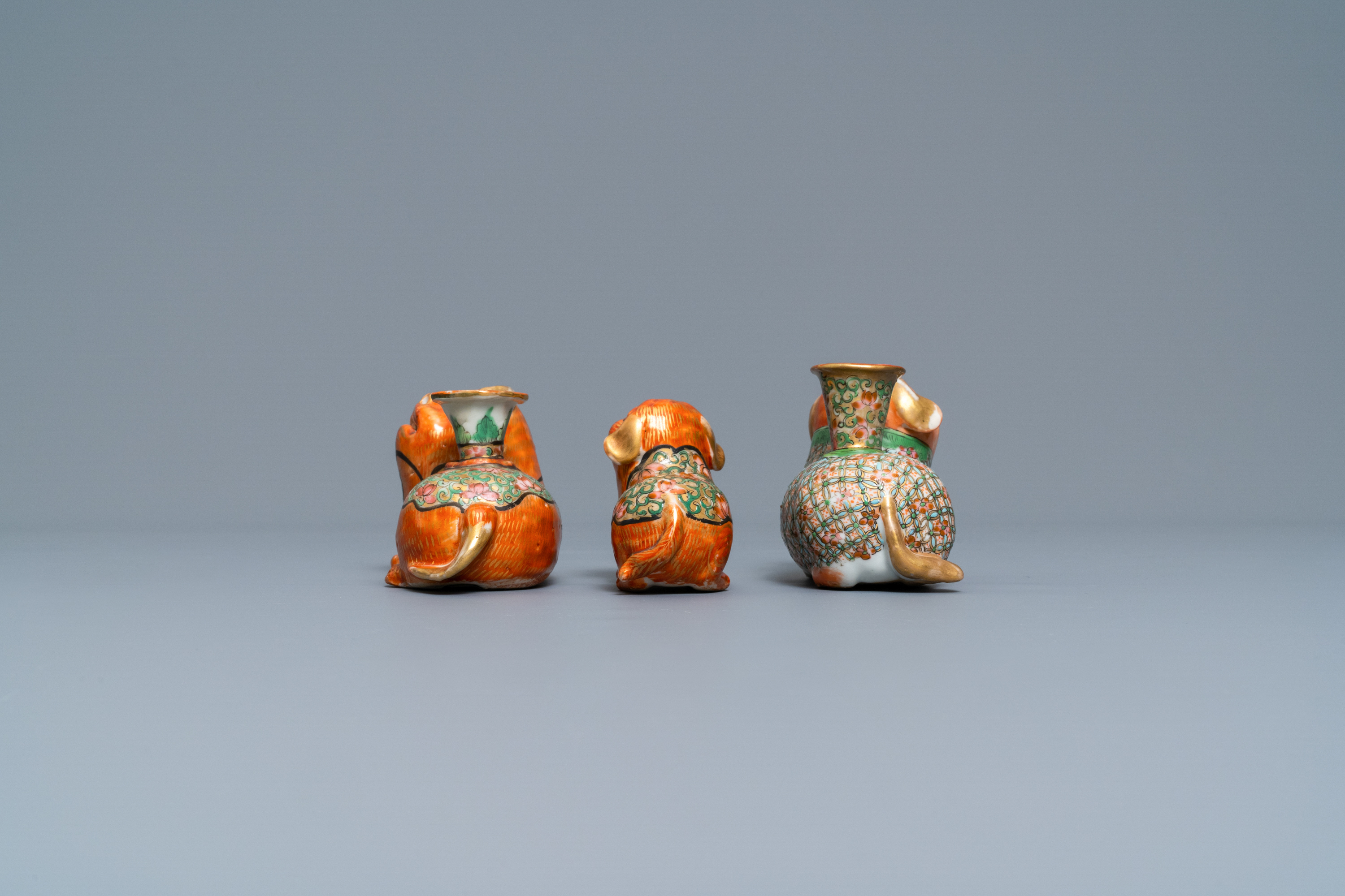 Three Chinese Canton famille rose models of dogs, two with candle holders, 19th C. - Image 5 of 7