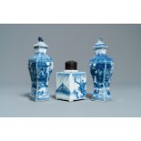 A pair of square Chinese blue and white covered vases and a tea caddy, Kangxi