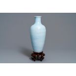 A Chinese monochrome lavender-blue vase with underglaze design, Yongzheng mark, 19/20th C.