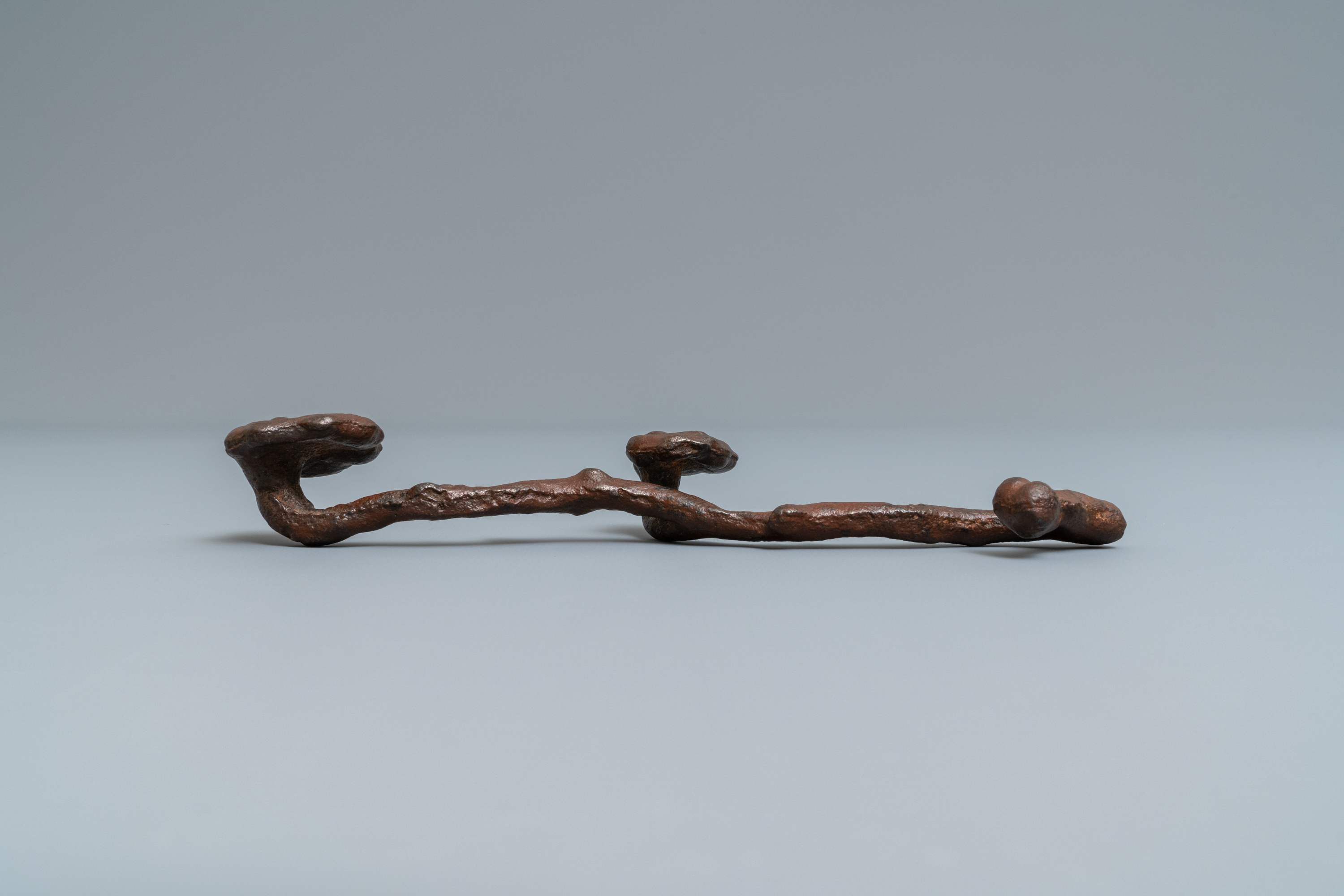 A Chinese cast iron brush rest in the shape of a lingzhi ruyi scepter, Ming - Image 2 of 7