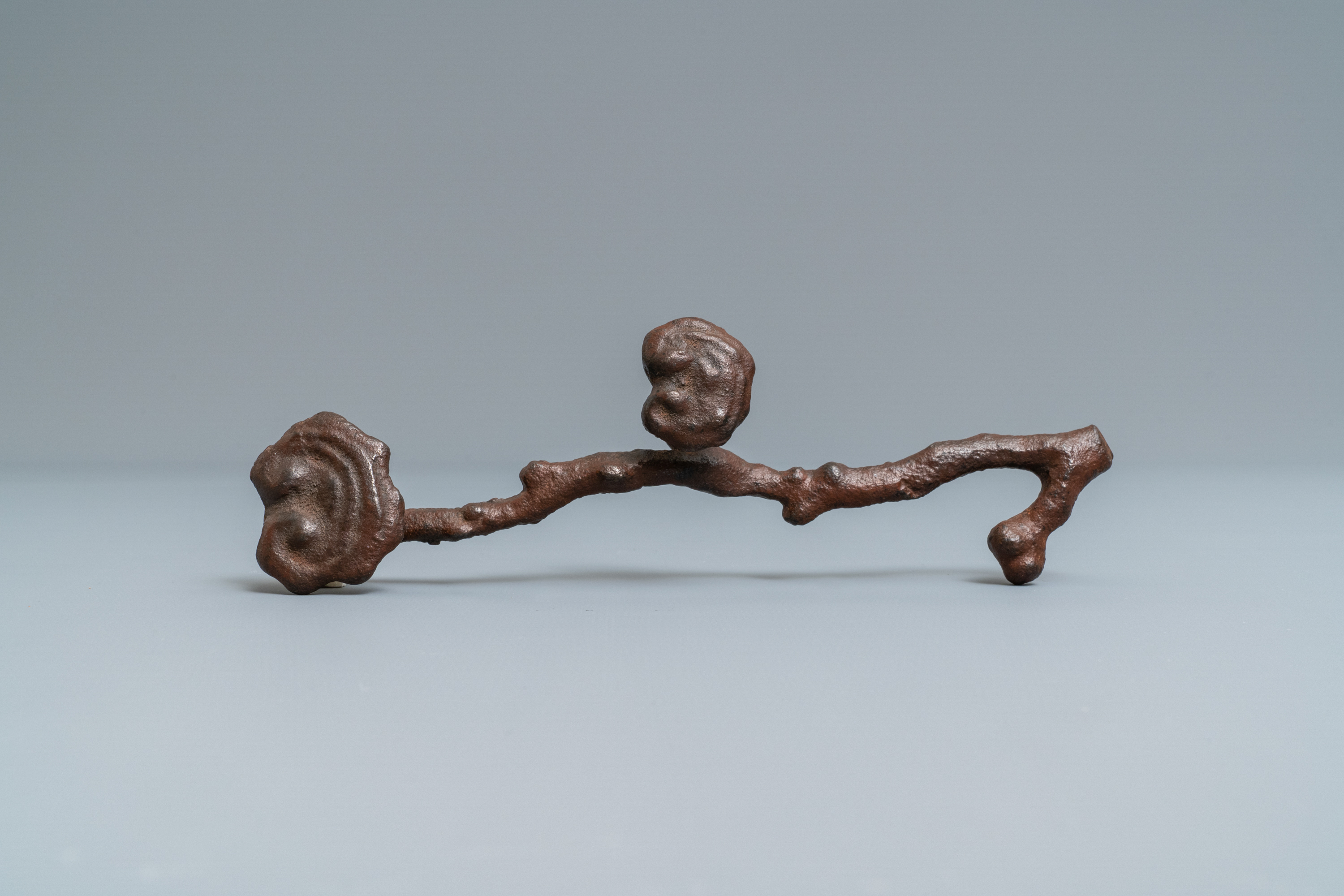 A Chinese cast iron brush rest in the shape of a lingzhi ruyi scepter, Ming - Image 6 of 7