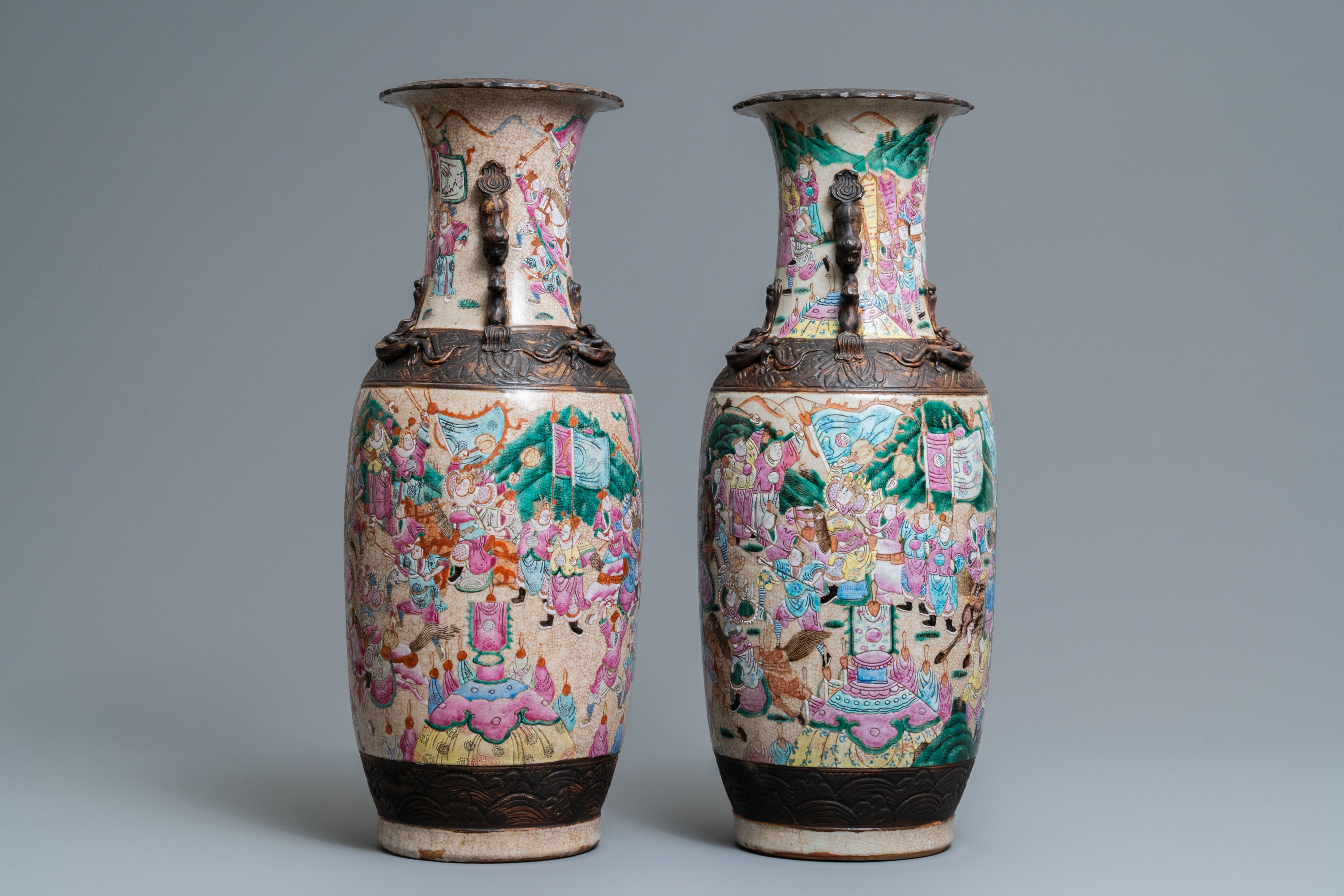 A pair of Chinese Nanking famille rose crackle-glazed 'warrior' vases, 19th C. - Image 4 of 6