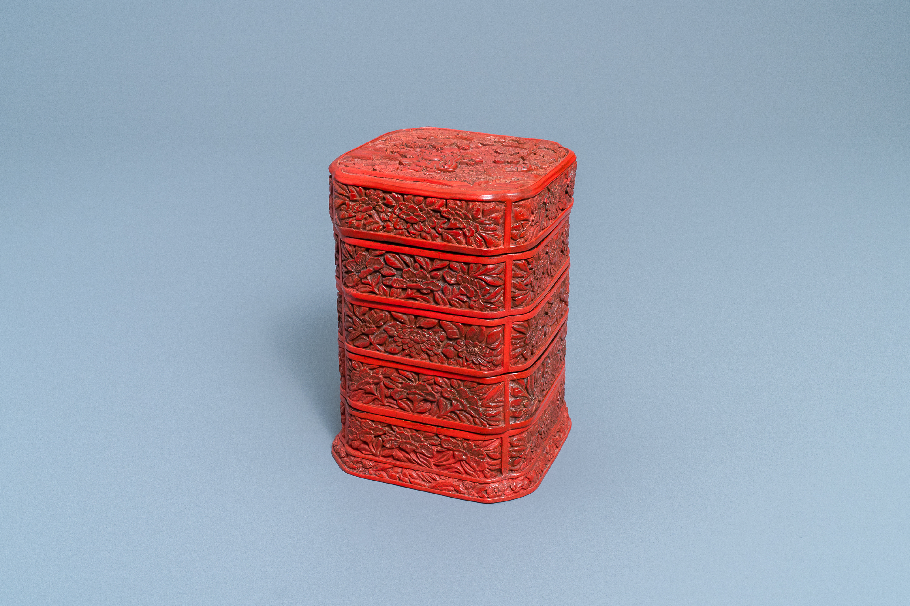 A Chinese red cinnabar lacquer four-tiered box, Wanli