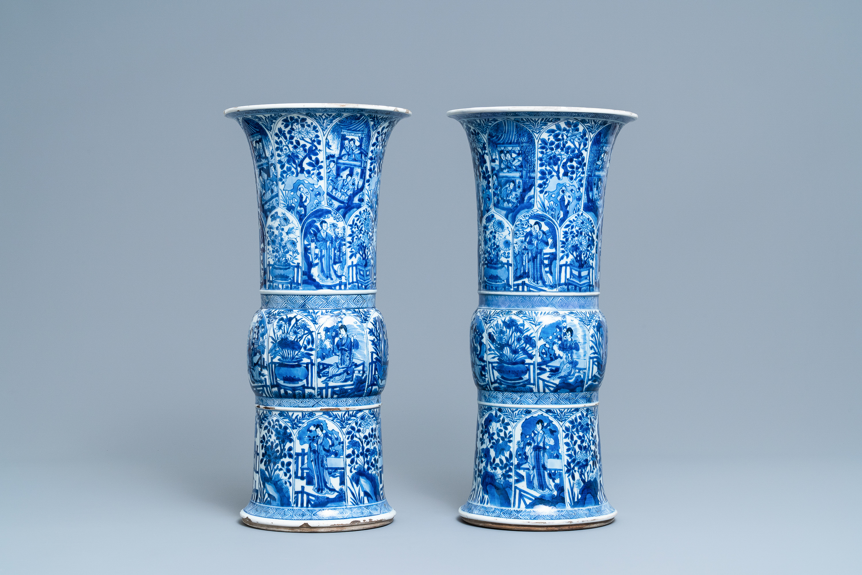 A pair of large Chinese blue and white 'Long Eliza' beaker vases, Kangxi