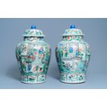 A pair of large Chinese famille verte vases and covers, Kangxi