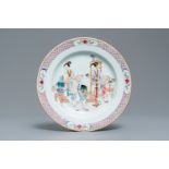 A fine Chinese famille rose ruby back plate with figures in an interior, Yongzheng
