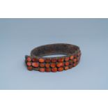 A leather marriage belt with carnelian and brass plaques, Balkan region, 18/19th C.