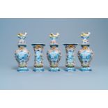 A polychrome Dutch Delft five-piece garniture with chicken-shaped finials, 18th C.