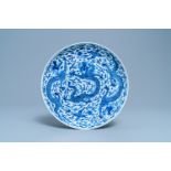 A Chinese blue and white 'dragon' dish, Kangxi mark and of the period