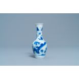 A Chinese blue and white bottle vase with figures in a landscape, Transitional period