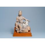 A Chinese painted wooden figure of Guanyin, Ming