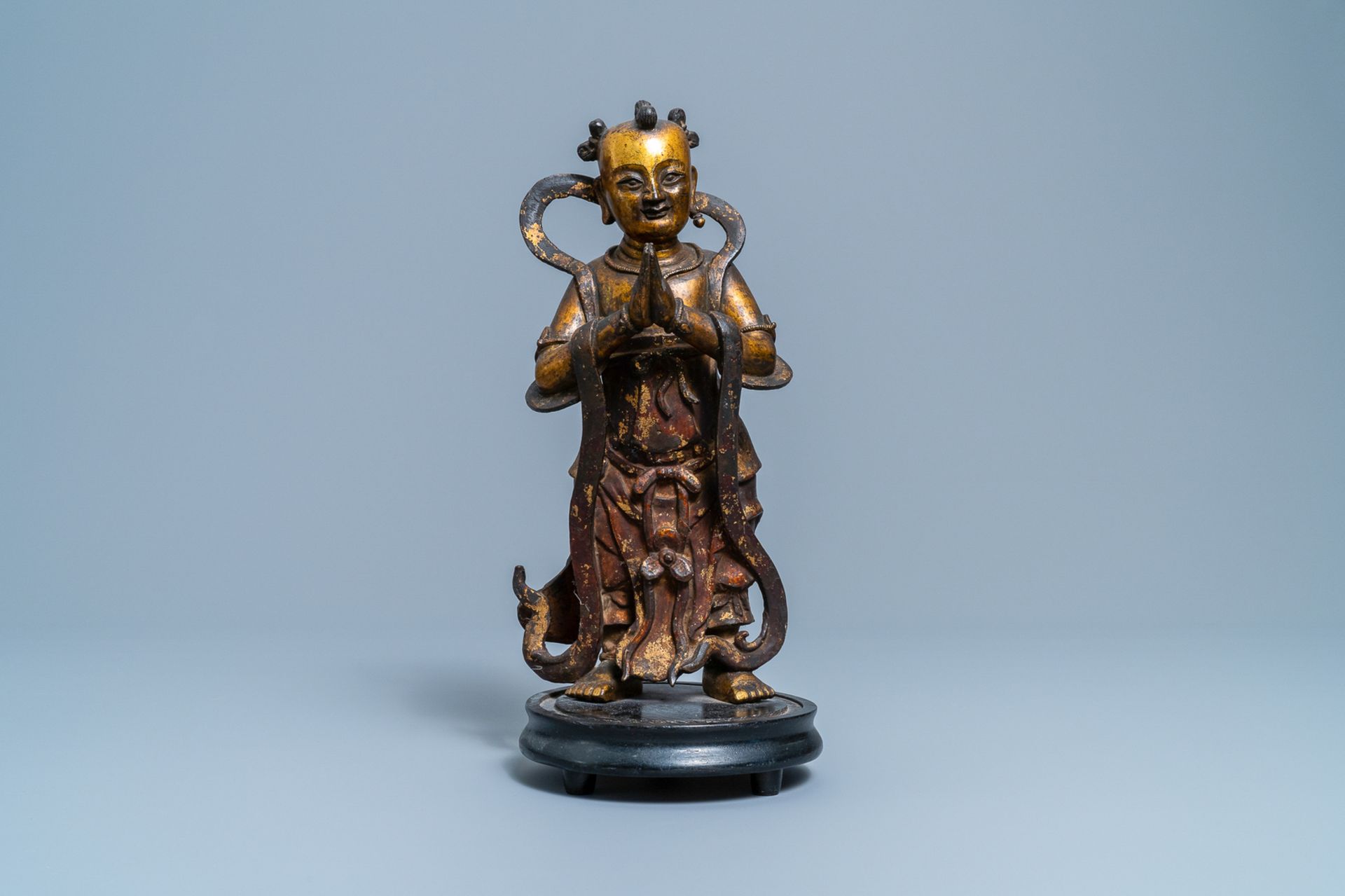 A Chinese lacquered and gilt bronze figure of a servant, Ming - Image 2 of 7