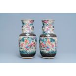 A pair of Chinese Nanking famille rose crackle-glazed 'warrior' vases, 19th C.