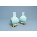 A pair of Chinese monochrome celadon vases with gilt bronze mounts, 18/19th C.