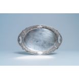 An oval silver tray with incised floral design, Thailand, 19/20th C.