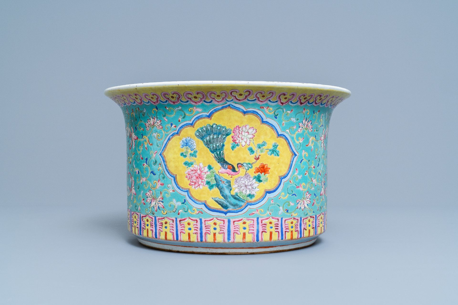 A Chinese turquoise-ground famille rose jardiniere, 19th C.