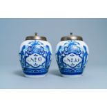 A pair of Dutch Delft blue and white tobacco jars with indians, 18th C.