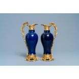 A pair of Chinese gilt bronze ewer-mounted monochrome blue vases, 18/19th C.