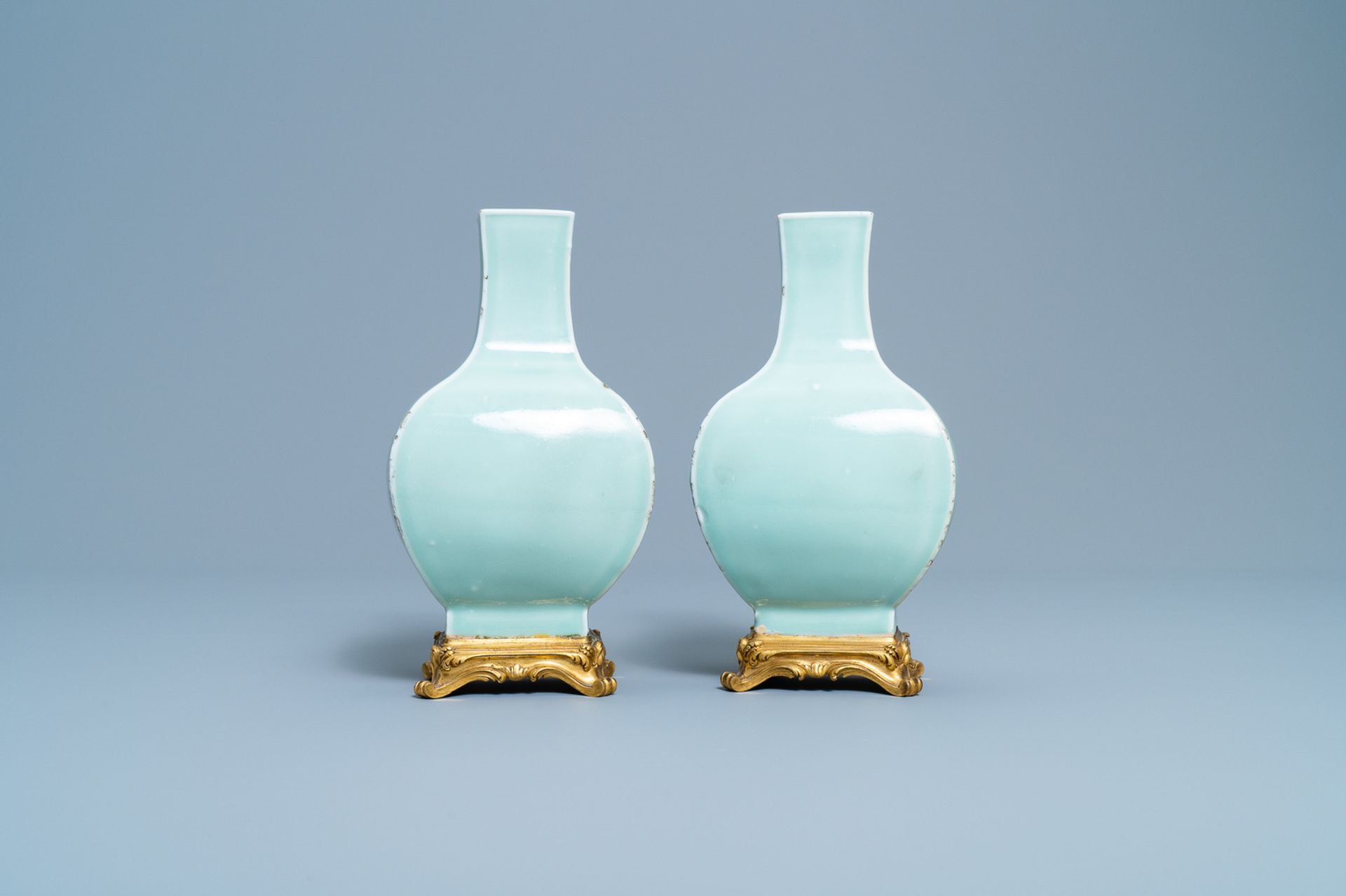 A pair of Chinese monochrome celadon vases with gilt bronze mounts, 18/19th C. - Image 4 of 7