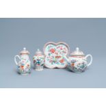 A Chinese famille rose teapot, tea caddy, milk jug and tray, Qianlong